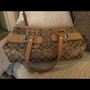 Older style very popular coach bag.